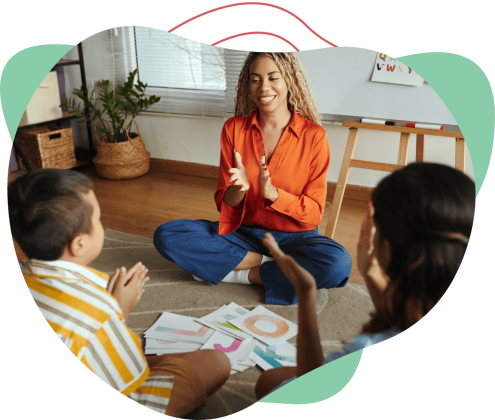 Downloads Banner - Therapist having fun with children with simple DIY materials